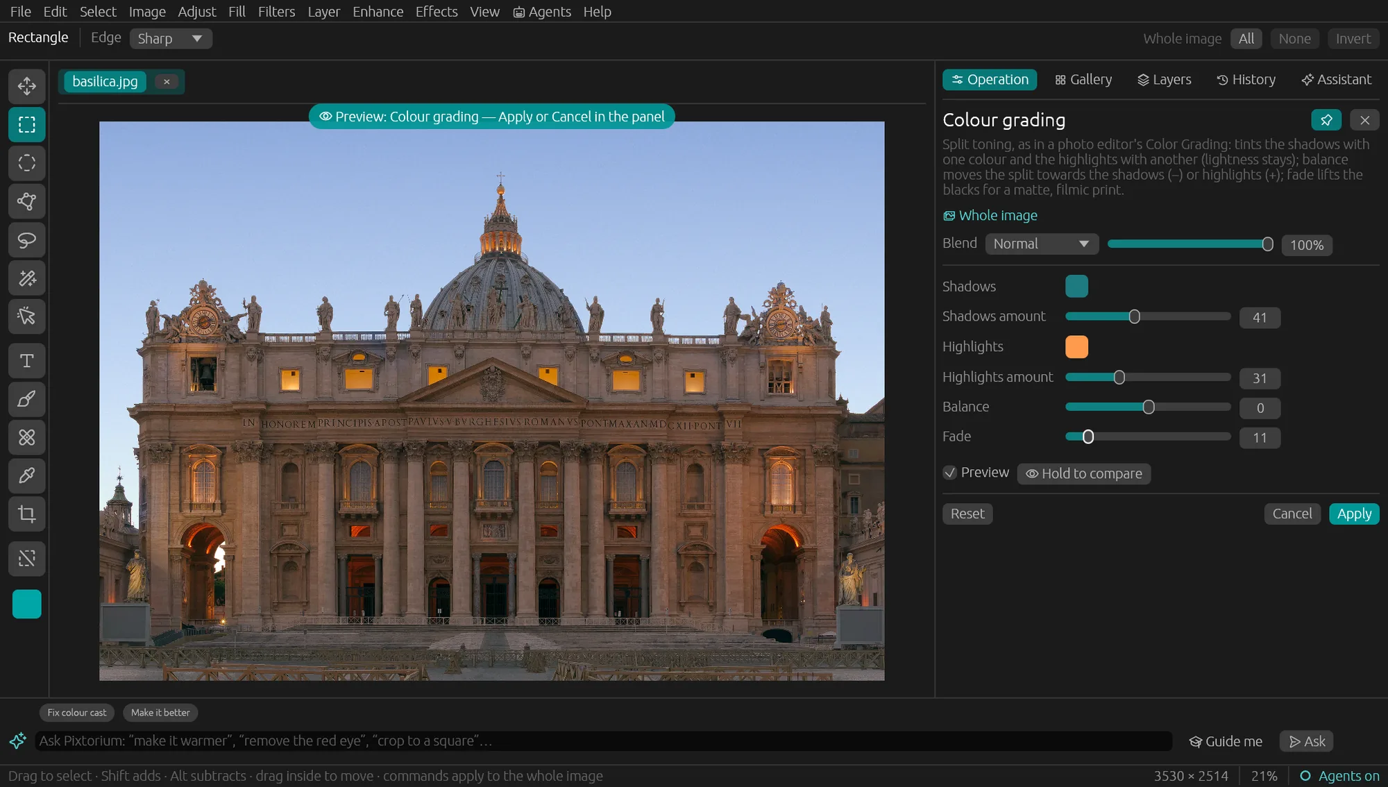 A cathedral façade at blue hour with Colour grading open: teal shadows and orange highlights previewed live, with sliders for each.